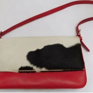 Neiman Marcus soft red leather bag with camp hair print.